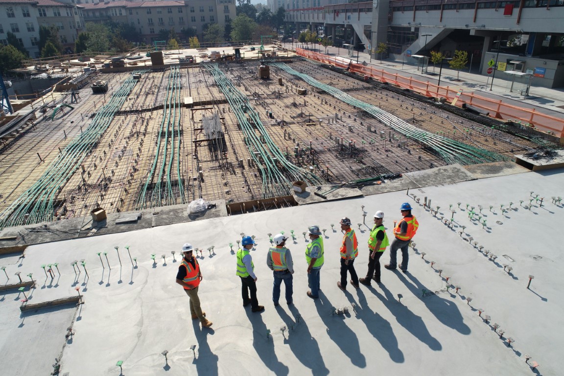 https://unsplash.com/photos/seven-construction-workers-standing-on-white-field-x-ghf9LjrVg